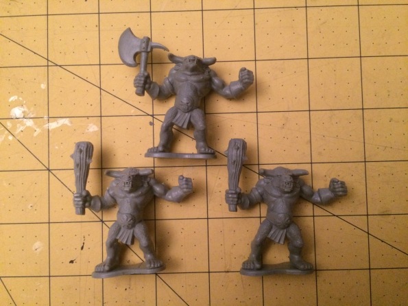These are the three plastic Minotaurs from Warhammer Quest.  These could be used in Beastmen or general Chaos armies.